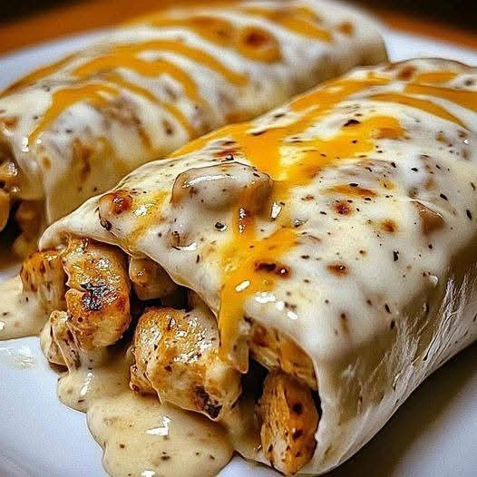 Tender Chicken Wrapped in Tortillas with a Rich, Creamy Cheese Sauce