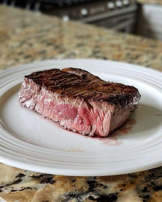 My sister and I can’t agree on how to cook a steak. I think this is medium-rare but she thinks it’s raw. Thoughts?