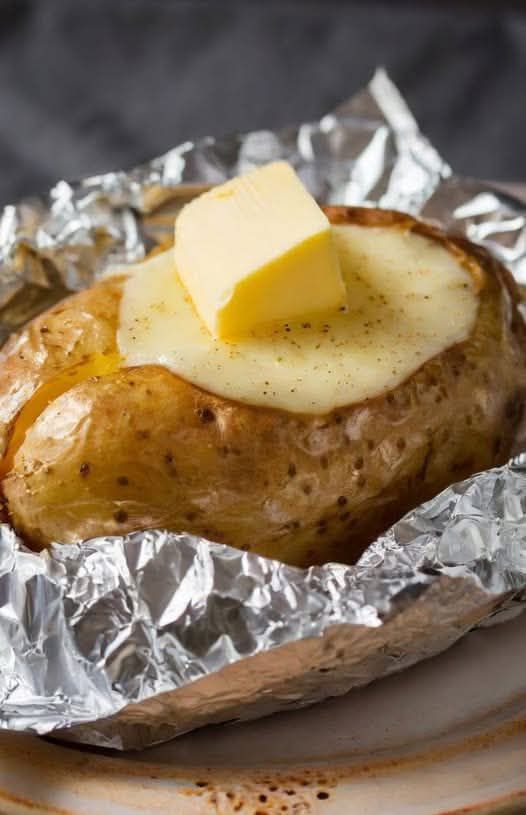 Perfect Baked Potato with Butter and Melted Cheese